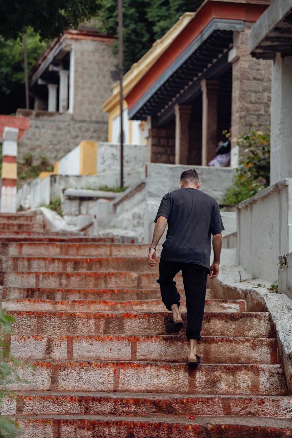Nick walking up temple steps in India